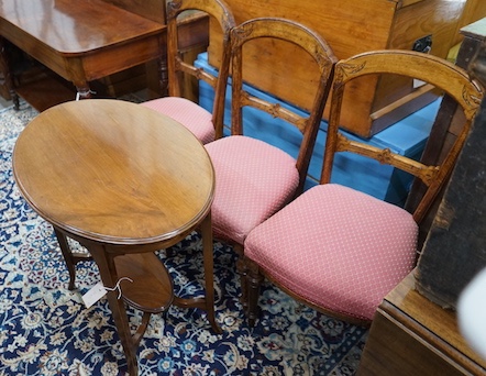 A late Victorian mahogany oval topped occasional table, width 75cm, height 71cm together with three Victorian oak dining chairs